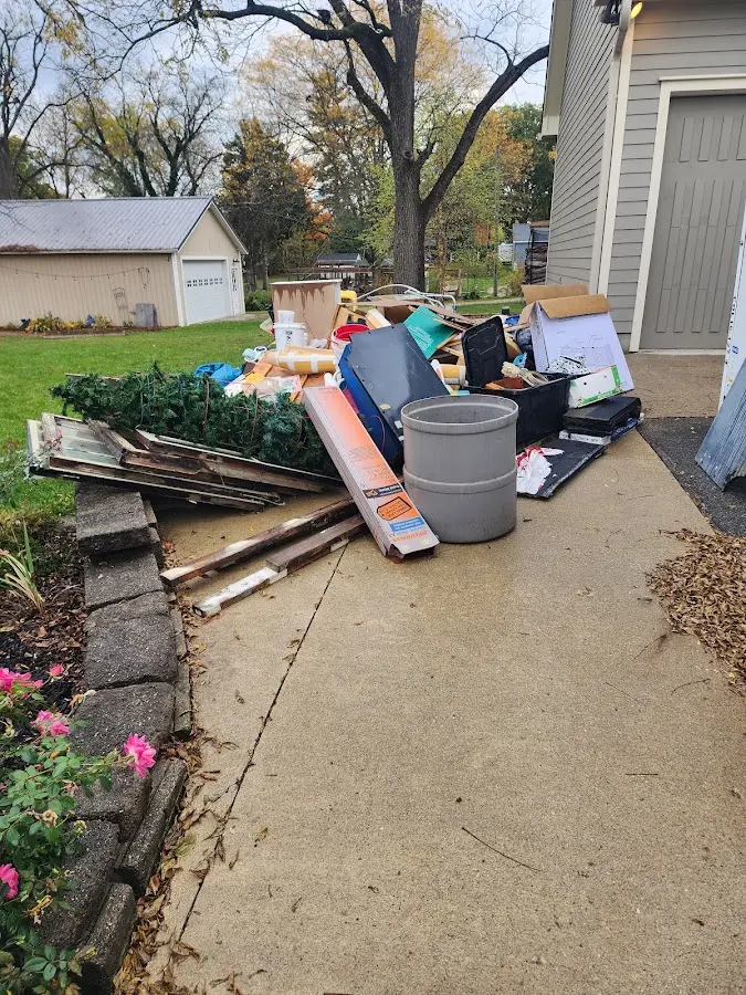 Dumpster being loaded with debris for Roofing Dumpster Rental in Avon